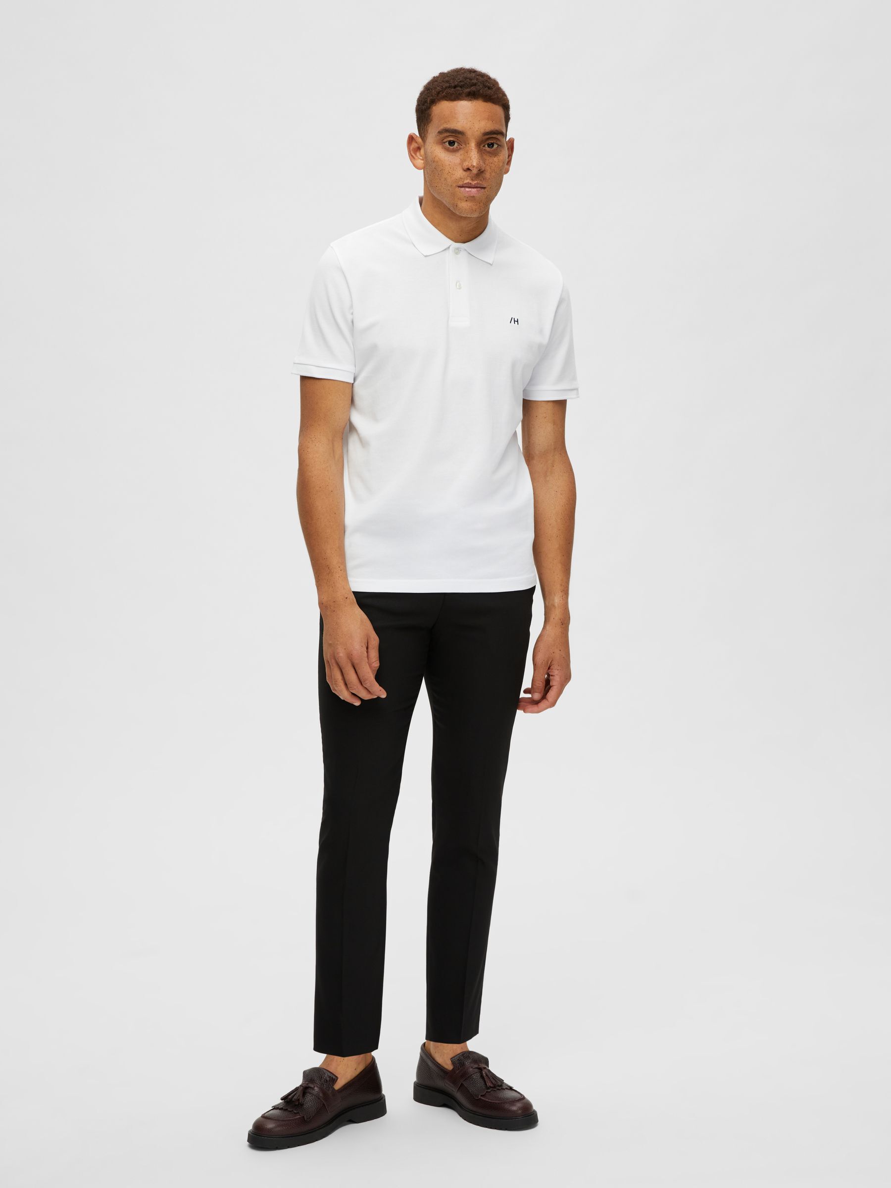 White polo shirt black pants sales
